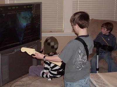 Kids playing Rock Band